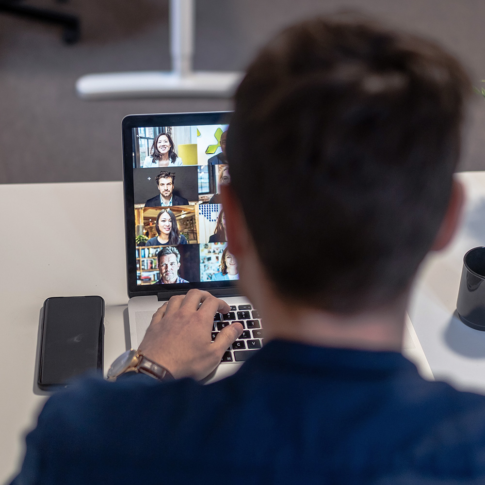 man on video call meeting