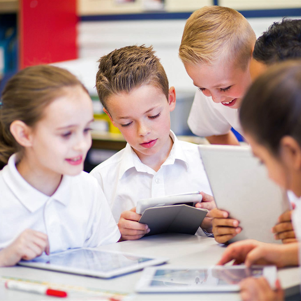 school-kids-learning-on-tablets